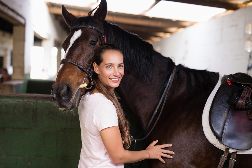 A female veteran in horse therapy