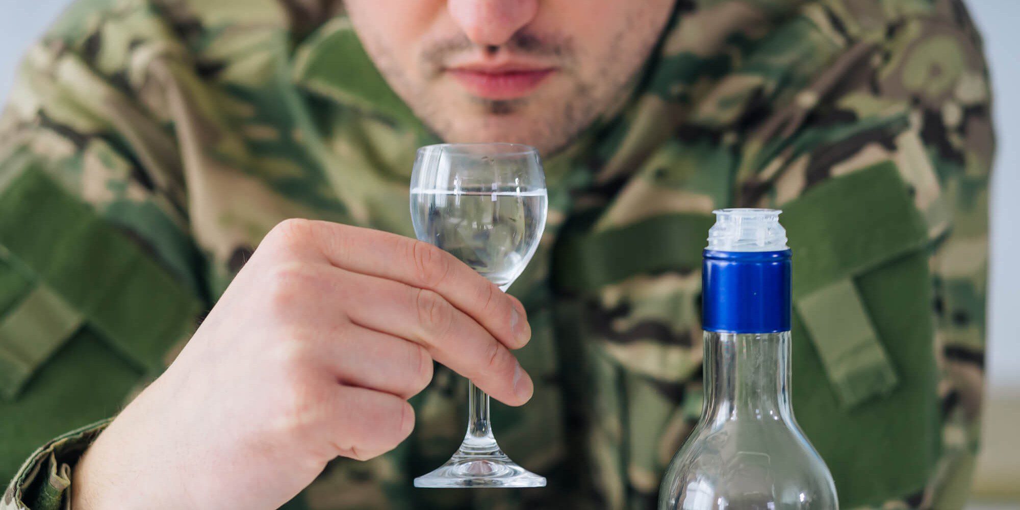 Closeup of a man drinking Veteran Alcoholism